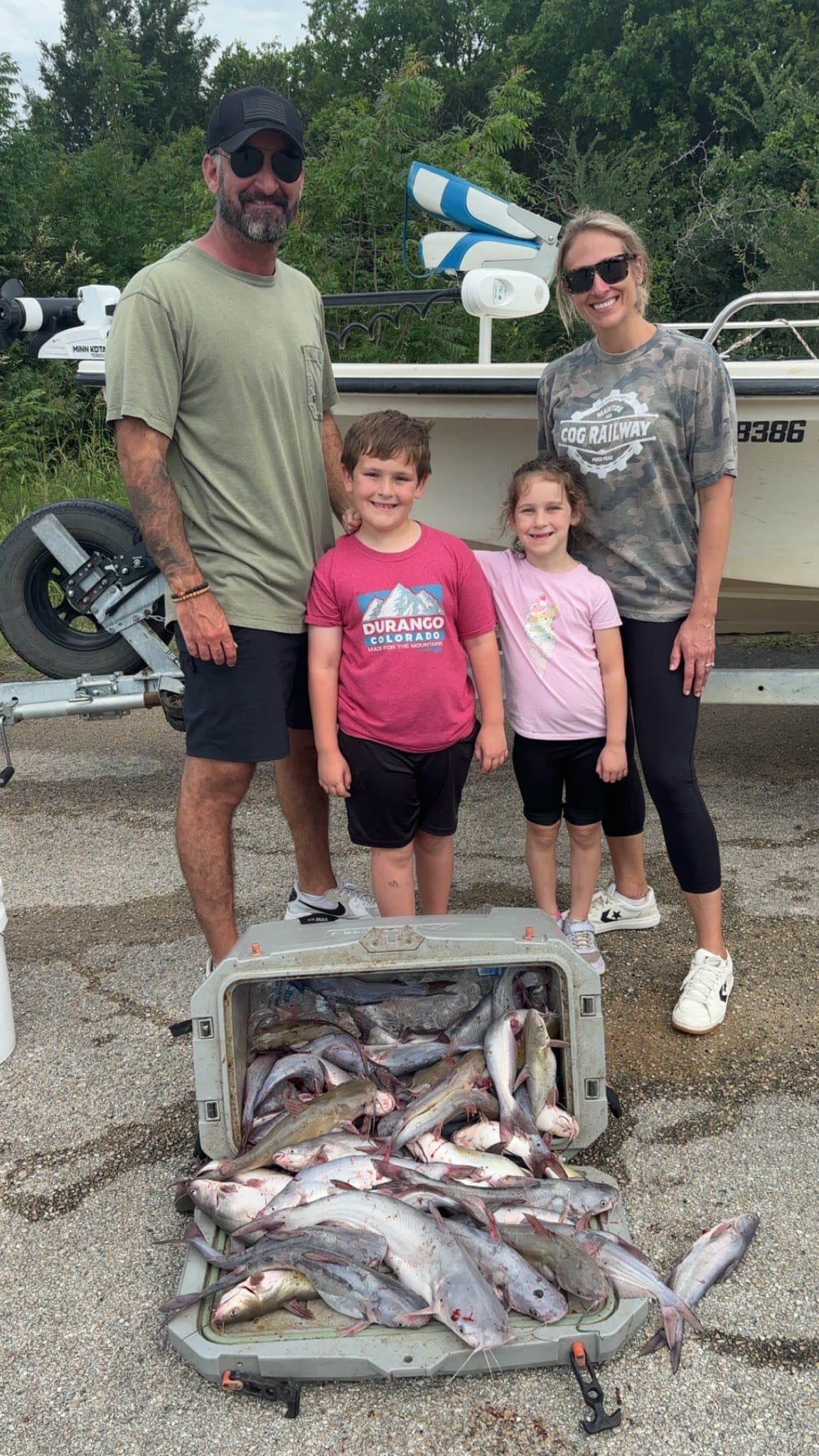 Family trip with kids and their catfish haul